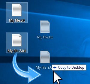 Снимок экрана: Копирование двух файлов на рабочий стол Windows 10.